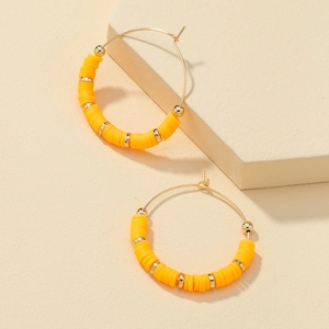 Bohemian large hoop earrings with bright yellow heishi beads and gold metallic accents