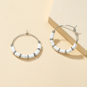 Bohemian silver hoop earrings with white Heishi beads and spherical metal spacers