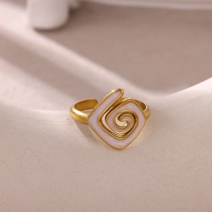 Gold plated stainless steel adjustable ring with white enamel swirl geometric design