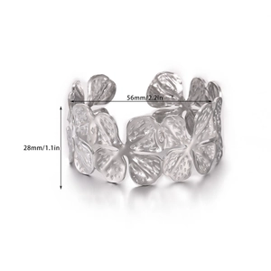 Detailed view showing a 28mm floral engraved cuff bracelet with size measurements