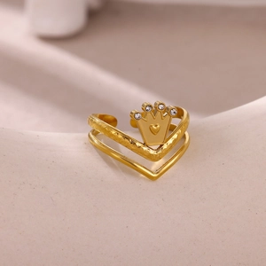 Macro detail of gold crown heart ring with double-layered band and cubic zirconia