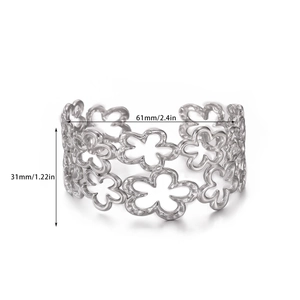 Detailed size view of silver hollow floral cuff bracelet measuring 61mm by 31mm