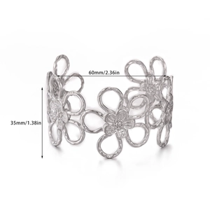 Detailed view of silver open cuff bangle featuring cutout floral patterns and dimensions