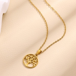 Elegant 18K gold plated stainless steel Tree of Life pendant necklace on leather texture
