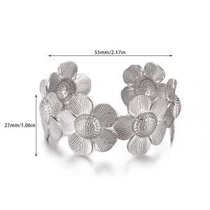 Detail view of silver daisy cuff bracelet showing 55mm diameter and petal texture