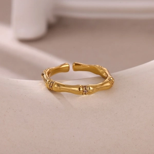 Detail of gold-plated bamboo joint ring featuring micro-paved cubic zirconia stones
