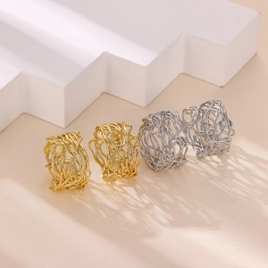 Artistic gold and silver hollow nest rings set with woven texture and minimalist design