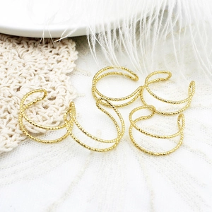 Lot de 4 bagues double couche plaquées or 18 carats avec texture cordelette