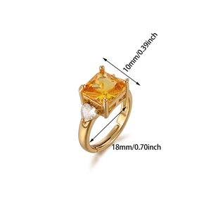 Detail of gold open ring with square orange zircon and small heart stones, 10mm width