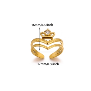 Detail of gold crown ring featuring a heart-shaped zircon and intricate textured band