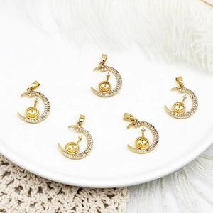 Detailed close-up of 18K gold plated crescent moon charms with micro-pave cubic zirconia