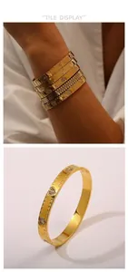 Dettaglio di 6 bracciali in oro 18K con zirconi e ciondoli a farfalla e cuore vintage