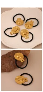 Close-up of golden straw hat hair tie with fine texture and black elastic band details