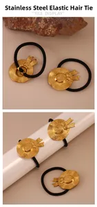 Detailed close-up of golden stainless steel straw hat charm on elastic hair tie