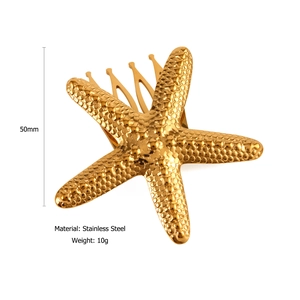 Detail view of a 50mm gold starfish hair comb made of durable stainless steel