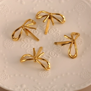 Set of 4 elegant 18K gold-plated bow hair clips with textured metallic finish