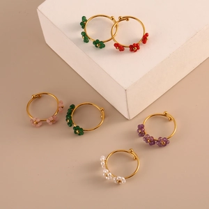 Adjustable golden stainless steel ring set with six colors of mini beaded flowers