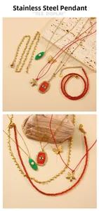Detail shot of stainless steel necklaces with starfish, evil eye and butterfly pendants