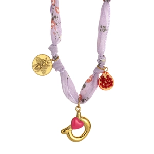 Detail of silk scarf necklace with bee coin, pomegranate charm and pink heart pendant