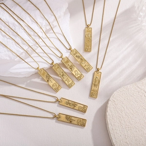 Detailed relief of vintage gold zodiac square pendants with astrological symbols