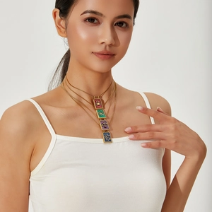 Layered vintage zodiac square necklaces with colorful enamel pendants on gold chain