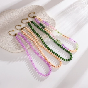 Handmade stone beaded necklaces in purple green and pink with golden metal clasp