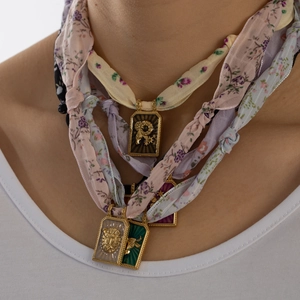 Handmade silk scarf necklace set with gold embossed zodiac pendants on floral ribbons