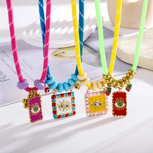 Colorful woven necklaces set with evil eye enamel pendants and vibrant beads
