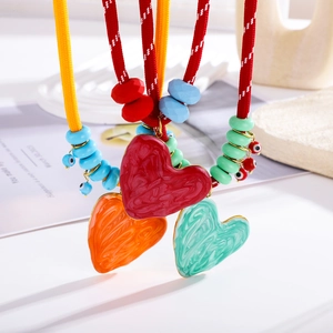 Bohemian woven rope necklaces with colorful beads and large marble resin heart pendants