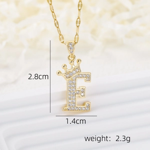 Macro shot of gold letter E crown pendant with size measurements 2.8cm by 1.4cm