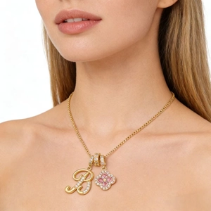 Gold Clover Necklace with Letter R Pendant and Pink Heart Stones on Model
