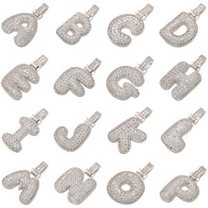 Detailed macro view of iced-out silver bubble letters A-P with micro-pave cubic zirconia