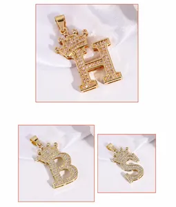Close-up of gold crown letter pendant with shimmering cubic zirconia micro-pave setting