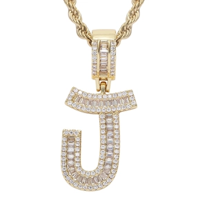 Detail of hip hop letter J pendant with rectangle cubic zirconia on gold rope chain