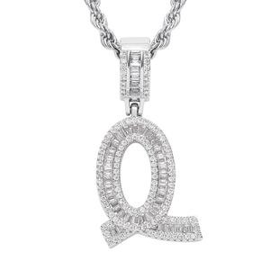 Macro shot of silver hip-hop letter Q pendant with micro-pave cubic zirconia on rope chain