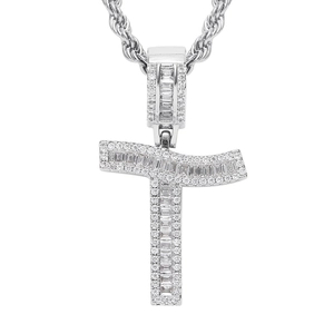 Macro shot of silver letter T hip hop pendant with cubic zirconia and rope chain