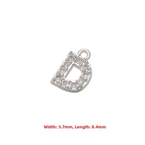 Detail of silver letter D pendant with sparkling zircon inlays and precise measurements