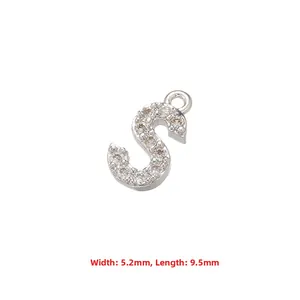 Macro shot of silver letter S pendant with zircon pavé, size 5.2mm by 9.5mm