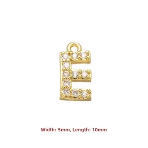 Detailed view of gold-plated letter E pendant with cubic zirconia, size 5mm by 10mm