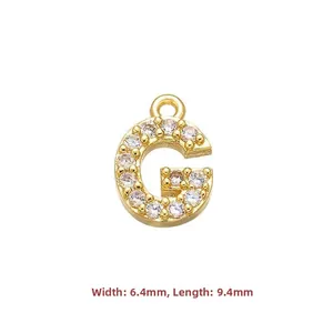 Macro view of gold letter G pendant with cubic zirconia and dimensions of 6.4x9.4mm