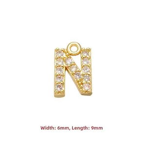 Detail of gold letter N pendant with cubic zirconia inlay measuring 6mm by 9mm