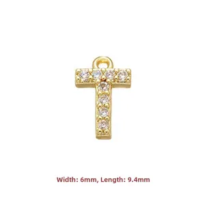 Close-up of golden letter T pendant with zircon crystals showing 9.4mm length dimensions