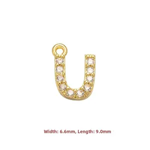 Detail view of gold cubic zirconia letter U pendant with precise 6.6mm by 9.0mm dimensions