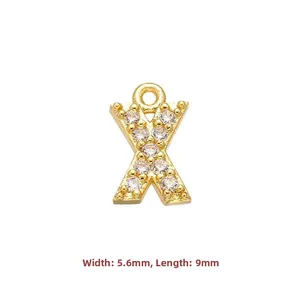 Detail view of gold letter X pendant with cubic zirconia inlay 5.6mm by 9mm