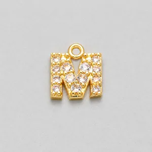 Detailed close-up of gold M letter pendant with pavé cubic zirconia for DIY jewelry