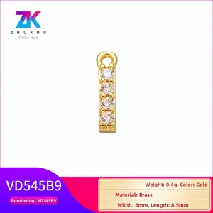 Macro detail of brass rectangular charm with cubic zirconia and specifications