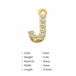 Detail of gold brass letter J pendant with micro-pave zircons, 8mm compact charm
