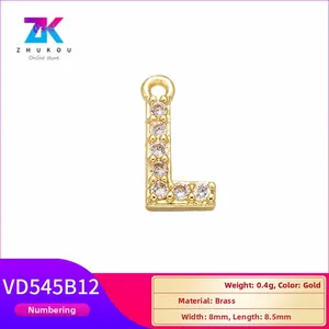 Detail of gold letter L pendant in brass with white zircon inlay and 8.5mm dimensions