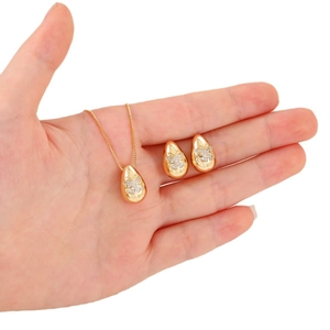 Elegant gold teardrop jewelry set with butterfly zircon inlay on a thin cross chain