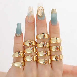 Colorful zircon initial rings in 18k gold plated copper with vibrant letter designs
